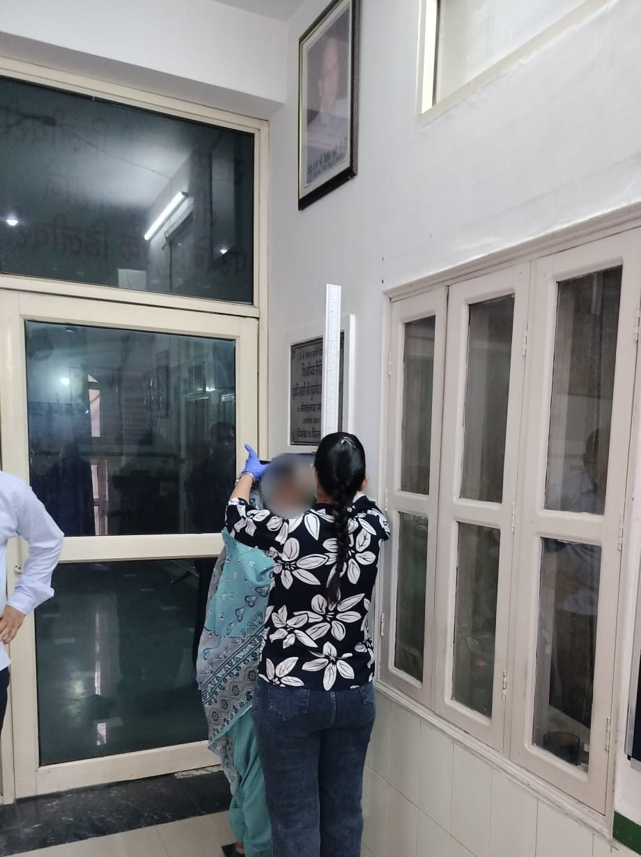 A health worker measuring a participant’s height at a Hope for Cancer camp in Panipat, Haryana