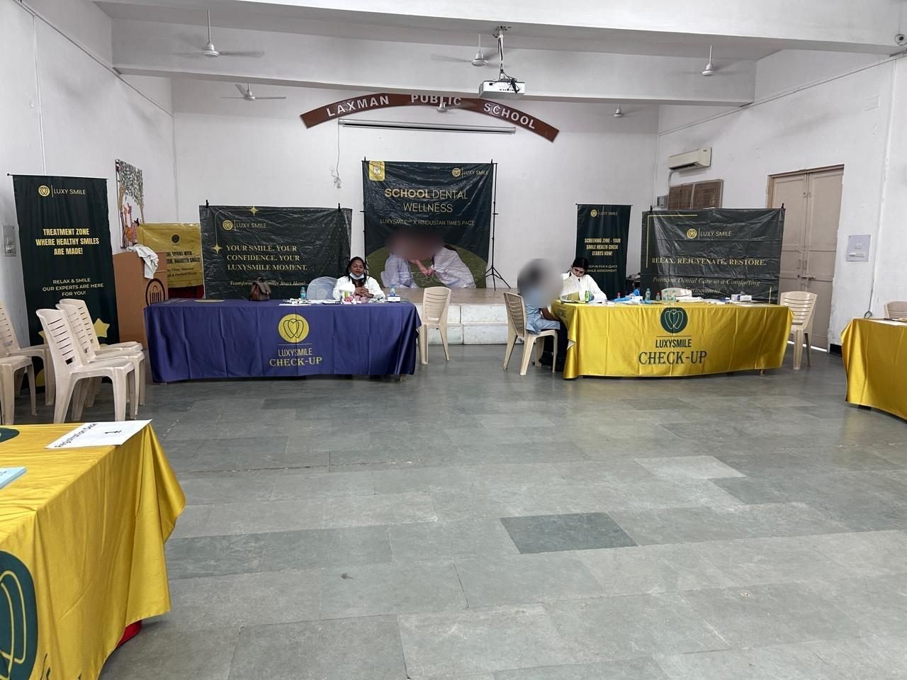 LuxySmile screening stations set up in a school hall in Delhi